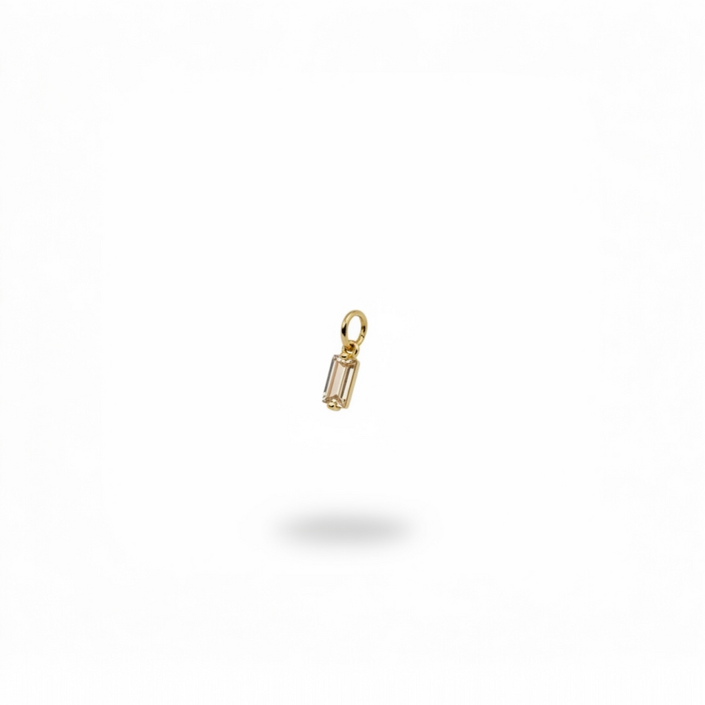 champagne-colored baguette crystal charm with gold-plated frame.