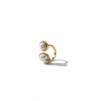 Gold open ring with two irregular white pearls on a white background