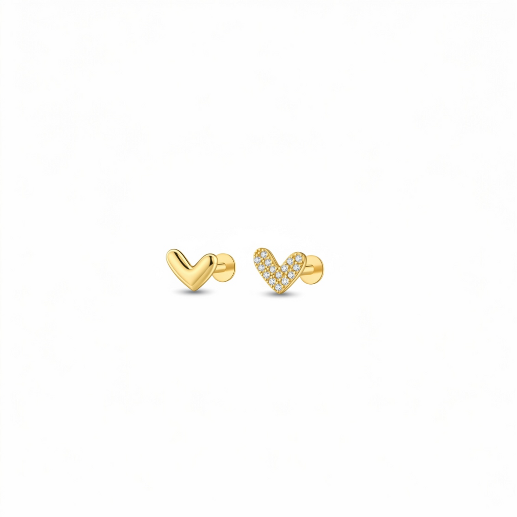 Pair of gold heart cartilage stud earrings made from 18K gold-plated 925 silver – one plain polished heart and one pavé zircon heart on flat-back posts, suitable for helix, upper ear and lobe piercings.