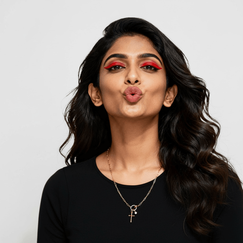 Model wearing Charm Link Necklace, 18K gold-plated stainless steel link chain with cross charm