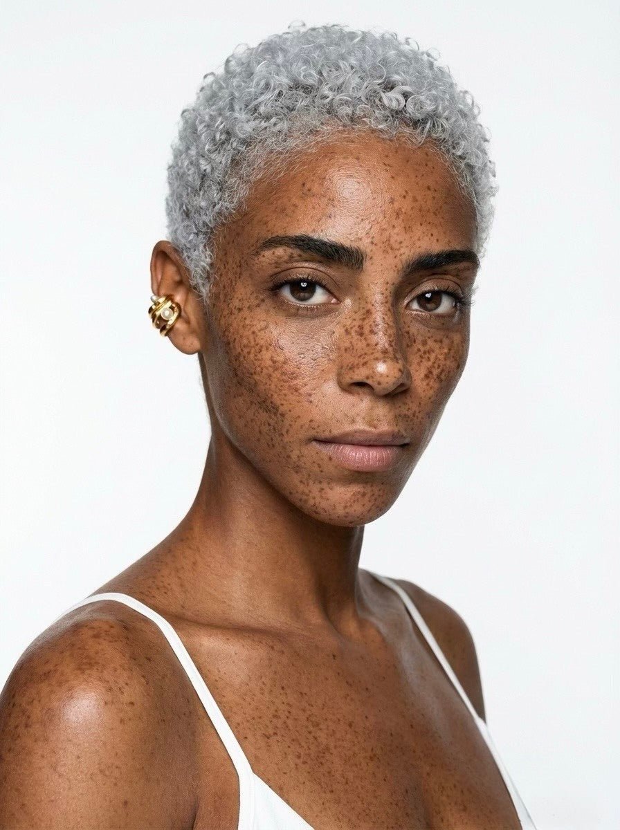 Model with short hair wearing sculptural gold pearl ear cuff – no piercing clip-on