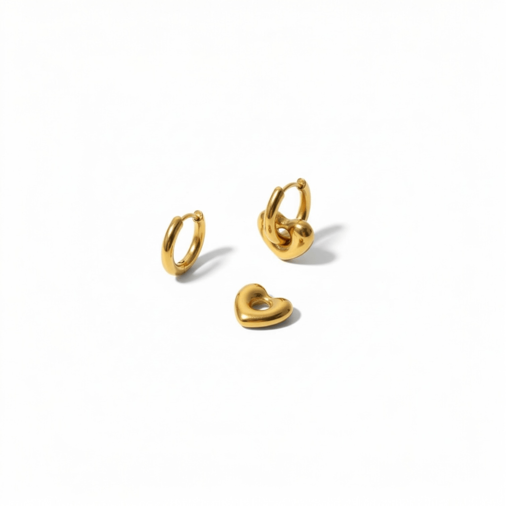 Heart Hoop Earrings worn on model ear close-up, gold heart drop