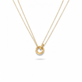 Layered Circle Necklace layered chains flat lay on white background