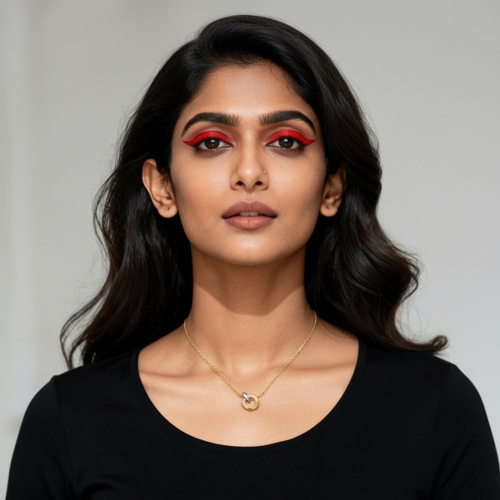 O-Ring Pendant Necklace worn by model with bold eye makeup and flowing hair, showcasing its two-tone design and elegance.